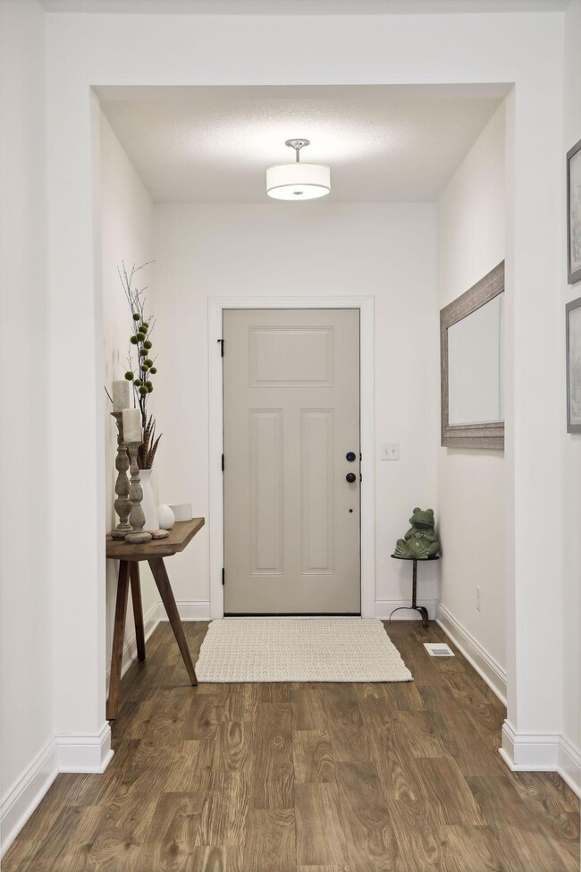 Entry way is roomy and features wide plank flooring!