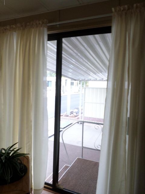 FROM LIVING ROOM OUT TO CARPORT