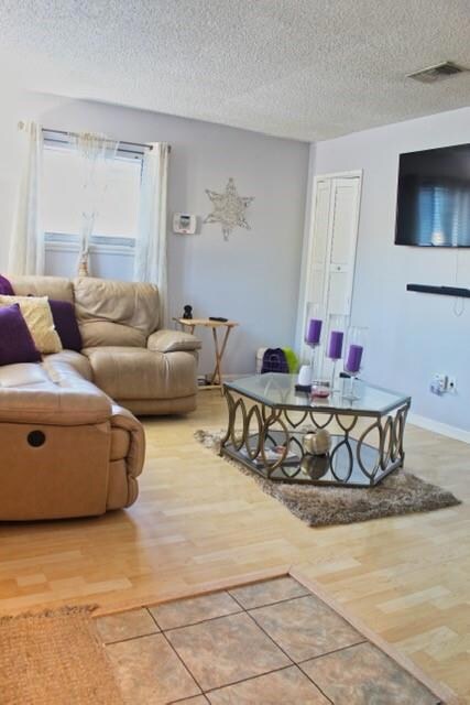 Bright living room space with laminate flooring an