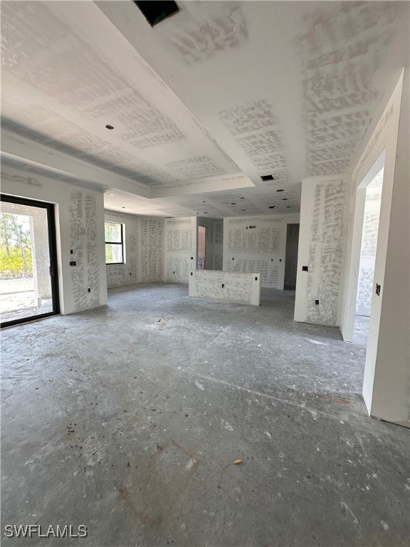 View of unfurnished living room looking at kitchen