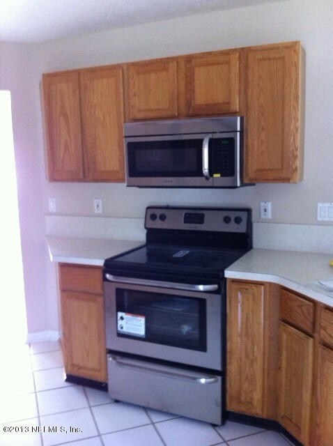 NEW STAINLESS STOVE & MICROWAVE