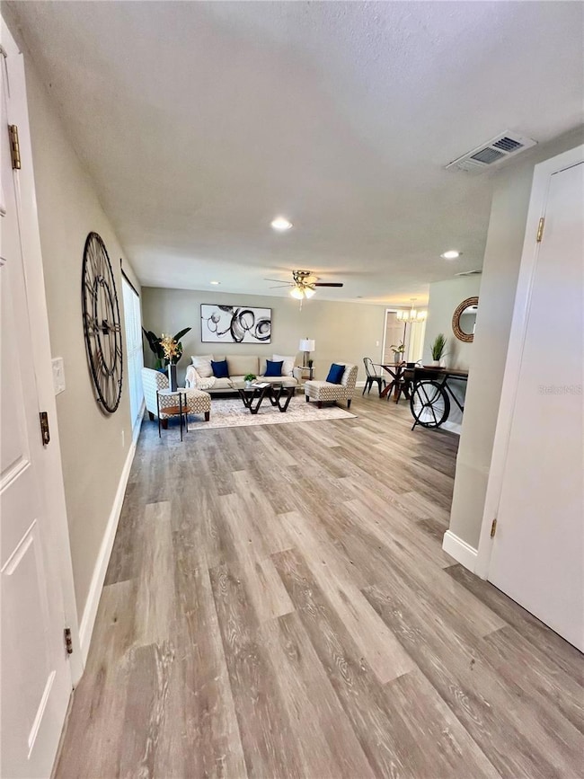 FRONT ENTERANCE LOOKING INTO FORMAL LIVING AND DINING AREA