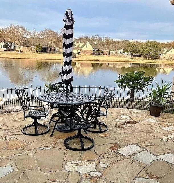 View of patio featuring a water view
