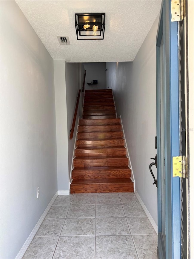 staircase to upstairs kitchen, bath and master BR