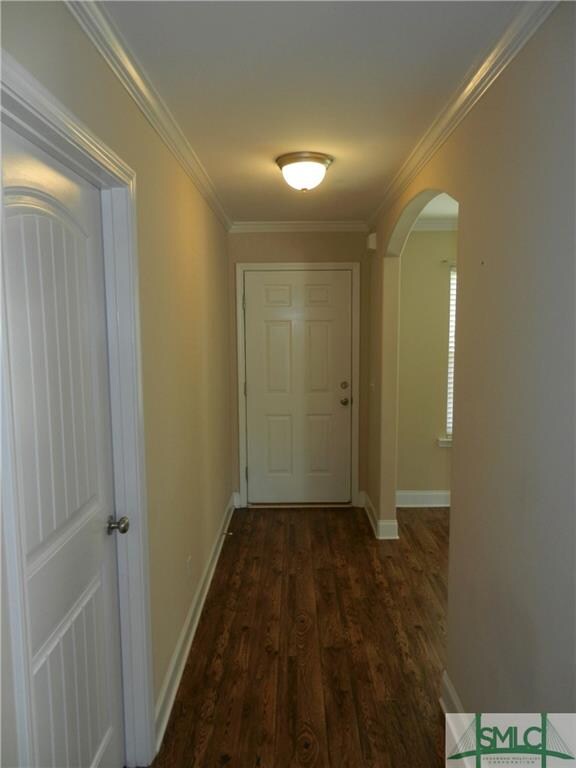 The entry opens onto the dining room and the door 