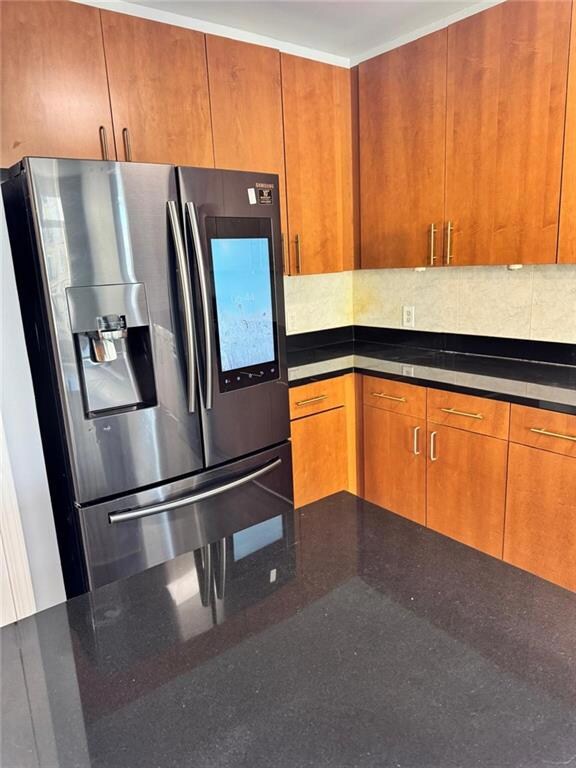 Kitchen with stainless steel fridge