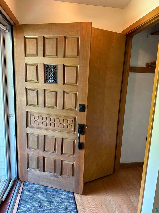 Entrance foyer featuring a newly refinished wooden