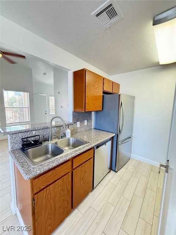 Kitchen with appliances with stainless steel finis