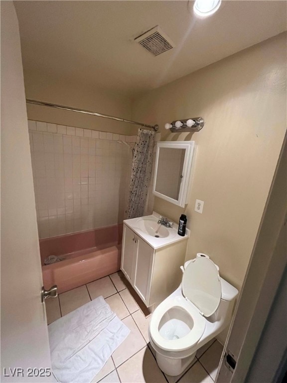 Bathroom with tile patterned floors, vanity, toile