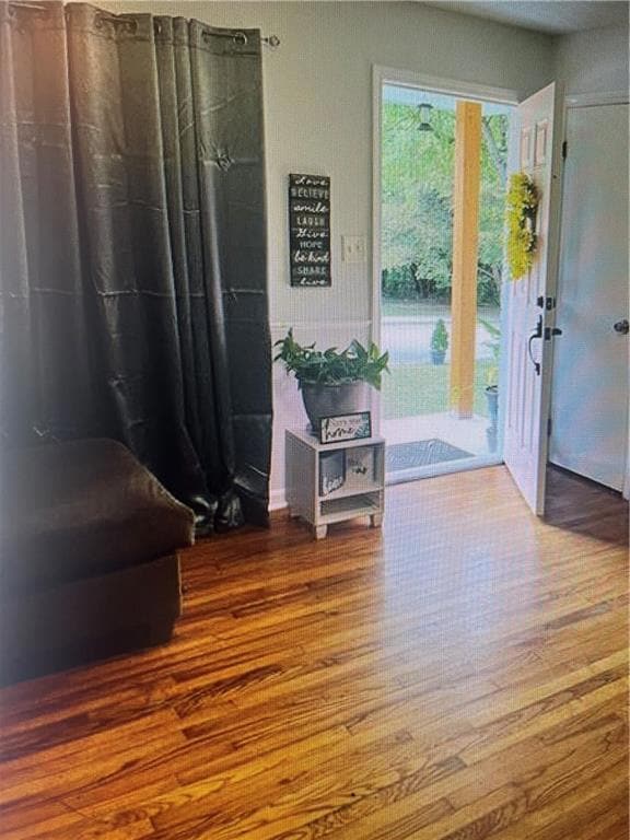 Foyer with wood finished floors