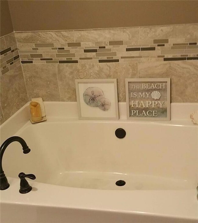Full bath with a garden tub