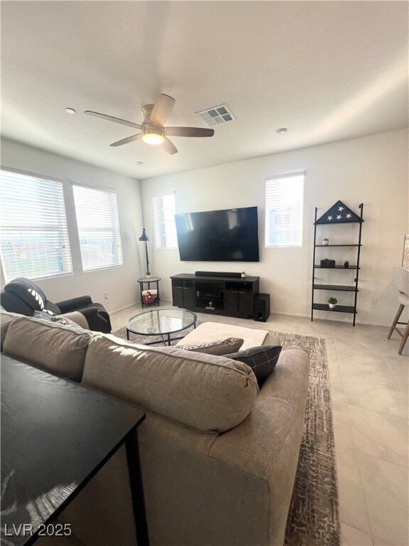 Living area featuring plenty of natural light, cei