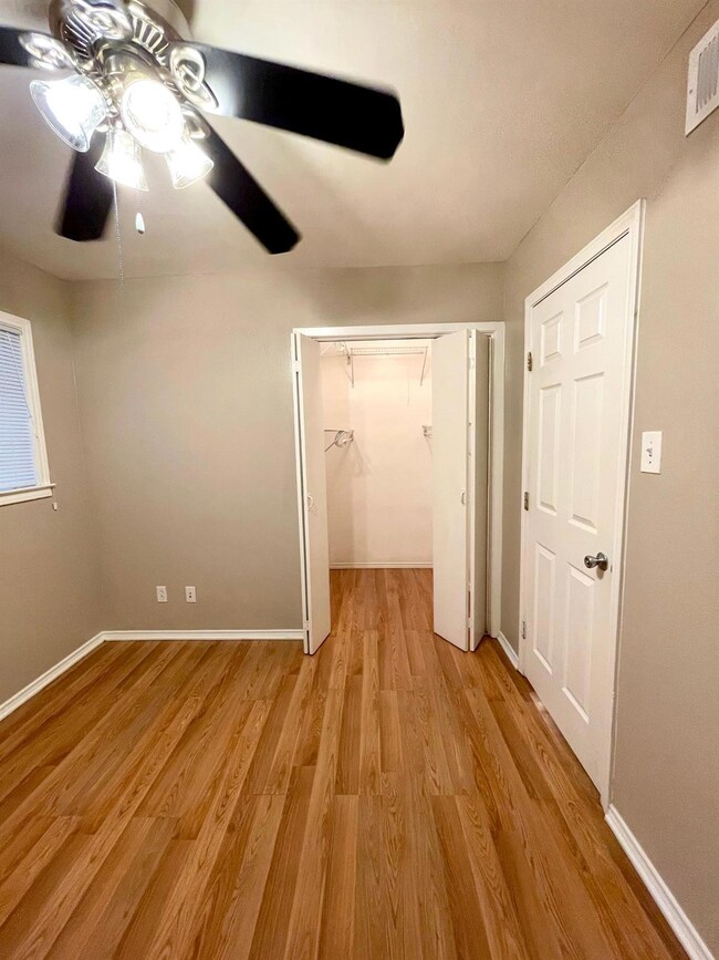 Unfurnished bedroom with light wood-style floorin