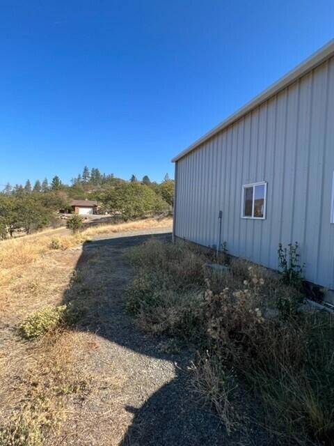 side of shed and welll shed in backgroun