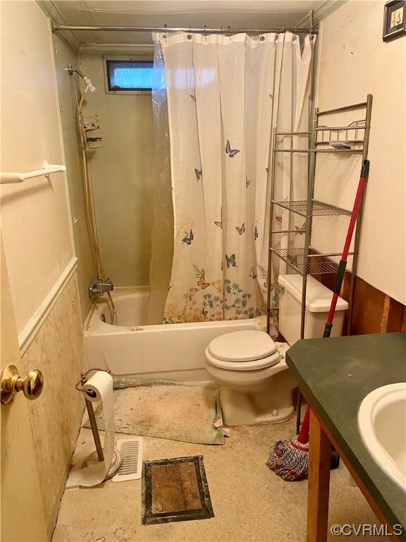 Full bathroom featuring vanity, shower / tub combo