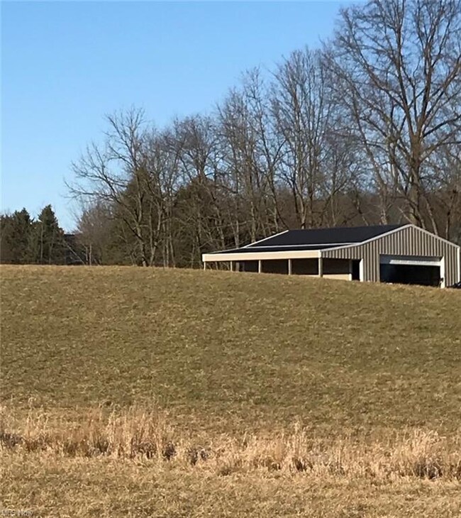 Cute view of the barn peaking out behind the hill.