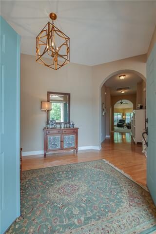 Foyer view through wide hallway to Den and rear ya