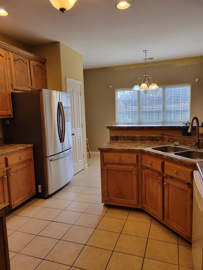 Kitchen with sink, hanging light fixtures, light t