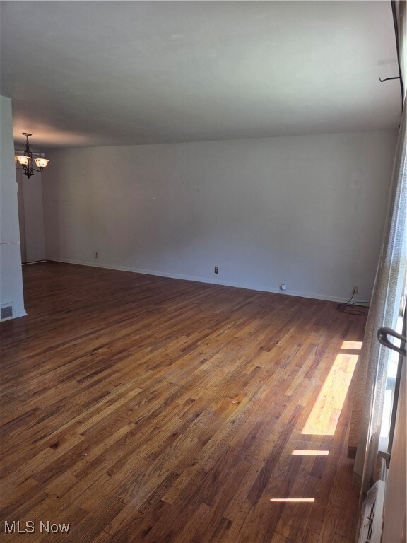 Spacious living room with hardwood flooring