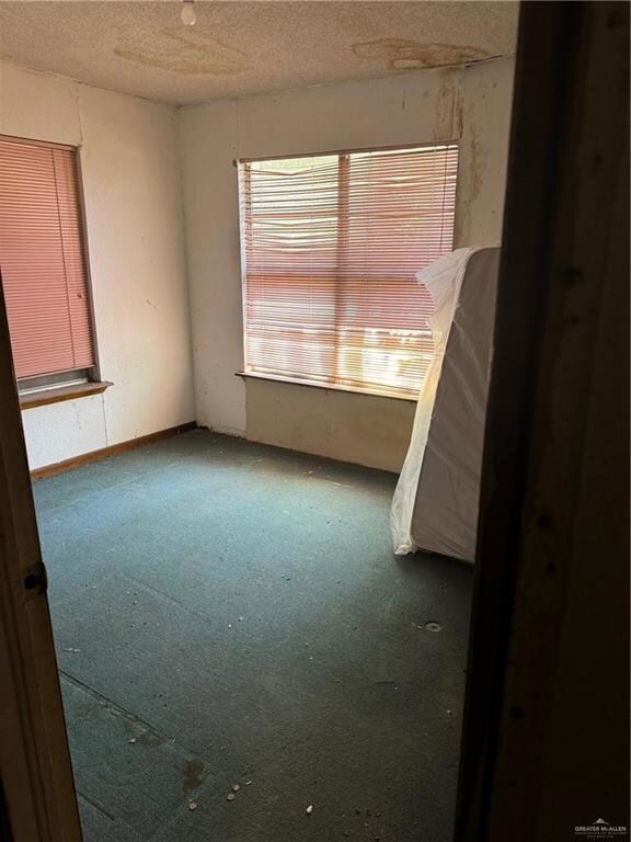 Spare room with a textured ceiling