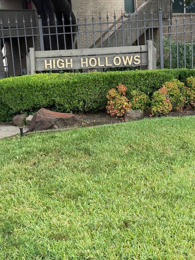 Community sign featuring a lawn