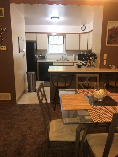View from the dining area into the kitchen.