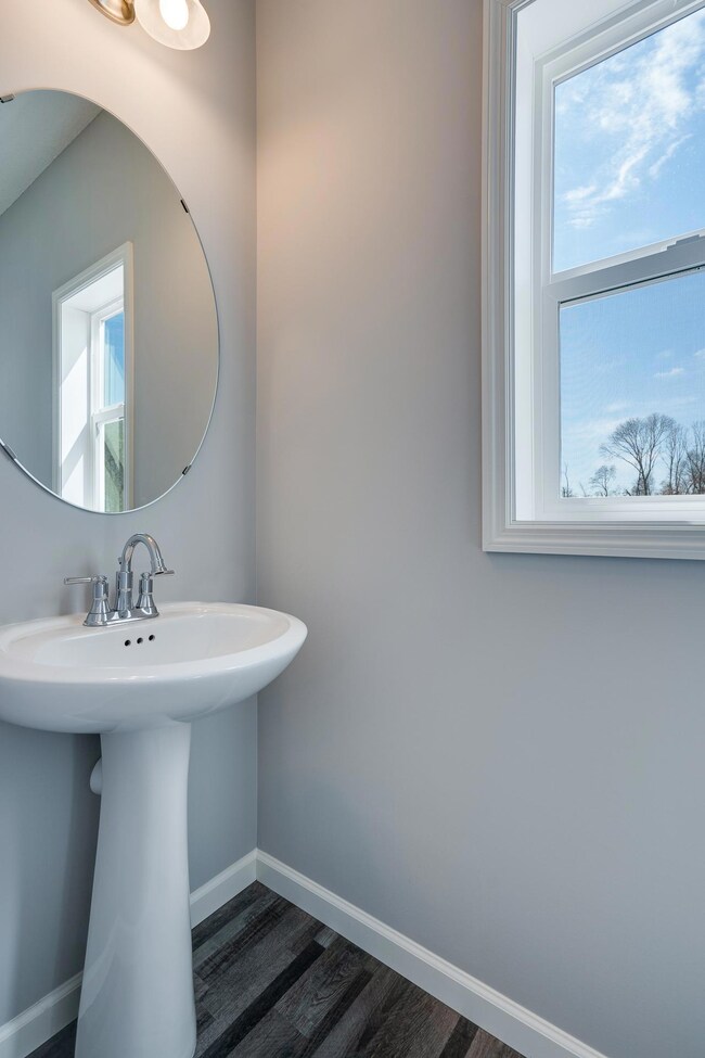 Main floor powder room-All photos are of previously finished home of same floor plan-upgrades and colors will vary