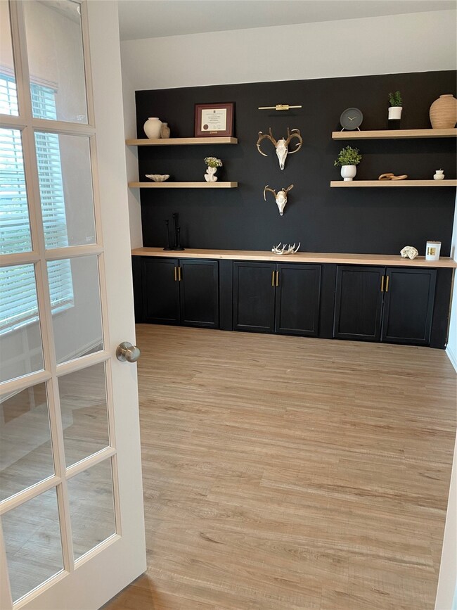 Elegant French doors with glass panes open into a