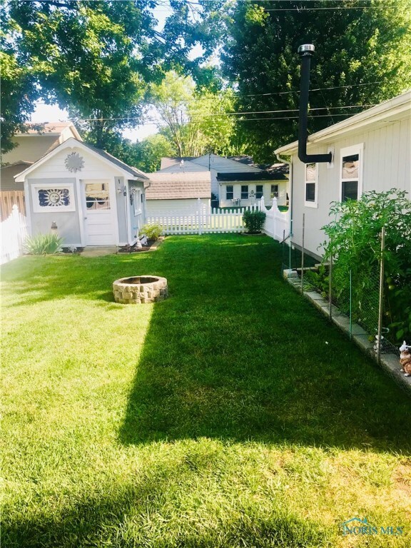 BACK YARD WITH FIREPIT AND SHED