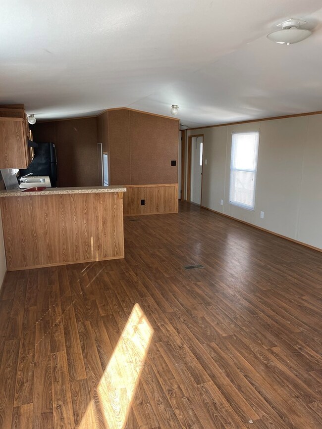Living room looking into dining/kitchen