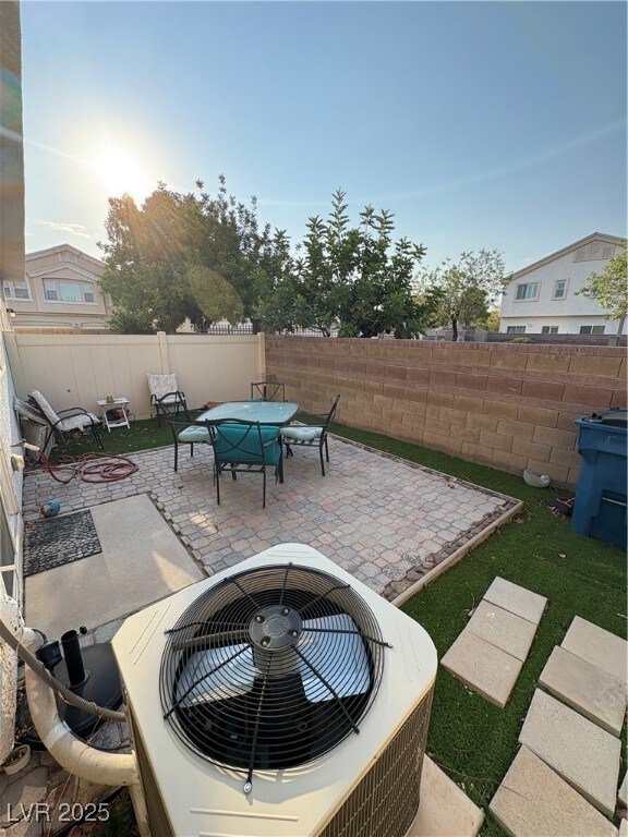 Fenced backyard featuring outdoor dining area and