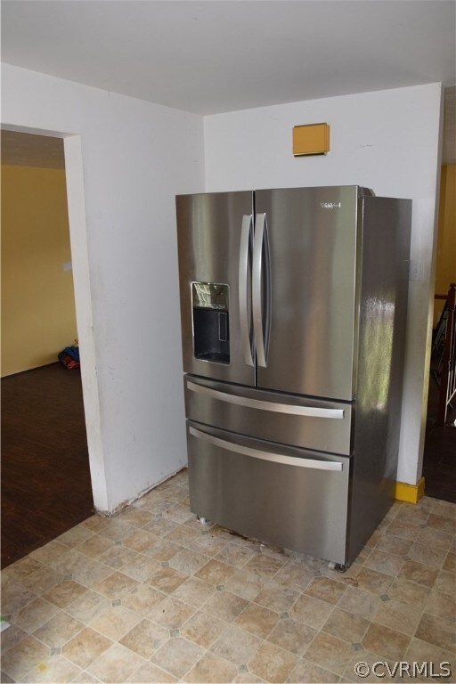 Kitchen featuring tile flooring and stainless stee