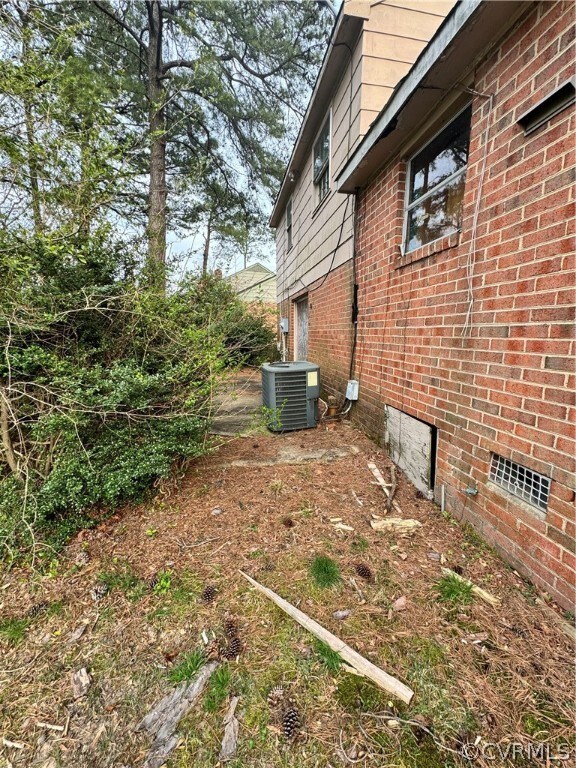 View of yard featuring central air condition unit