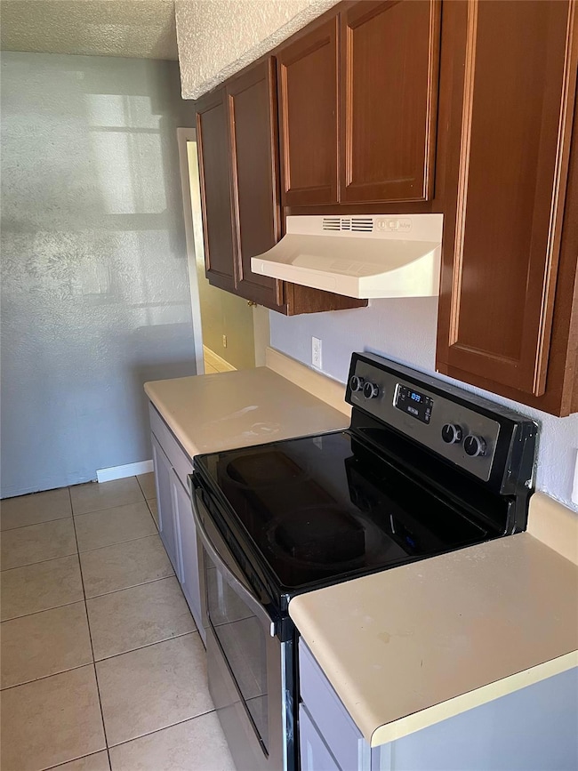 Kitchen featuring light countertops, ventilation 