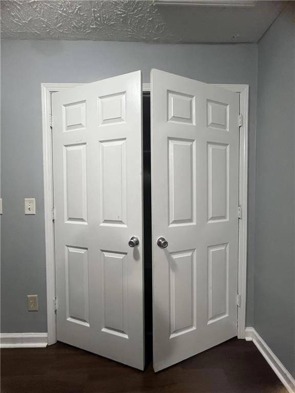 Detailed view of baseboards and wood finished floo