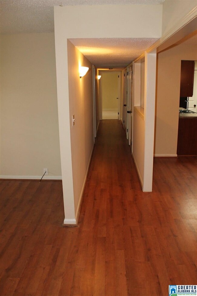 Hallway looking from the den to the master suite.