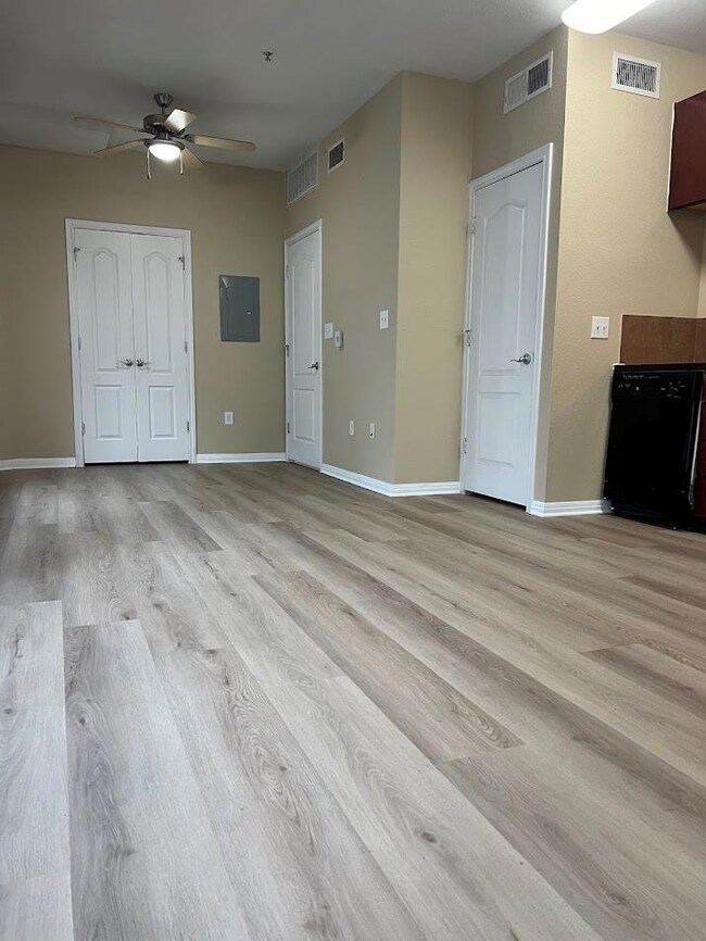 Unfurnished living room with light wood finished 