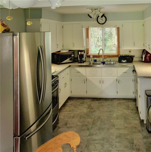 Large eat-in kitchen with stainless steel applianc