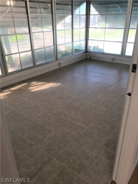 Tiled enclosed Florida room
