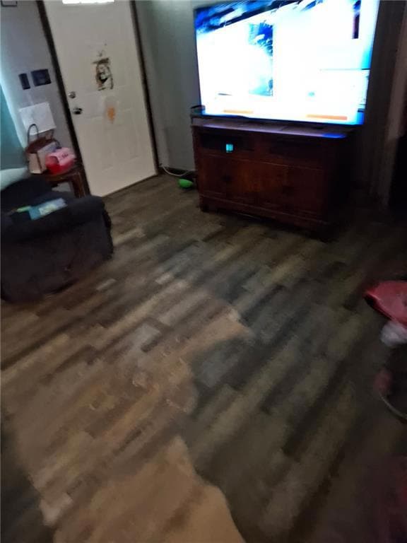 Entry door and Living room with plenty of natural light and dark wood-type flooring