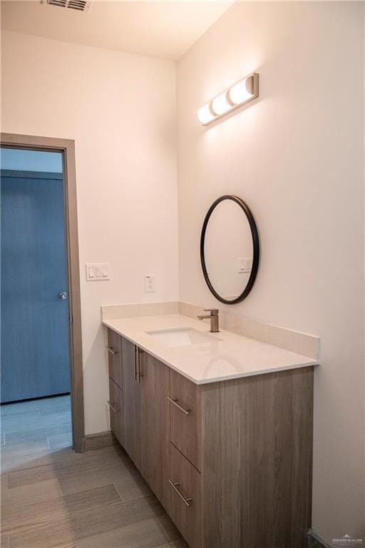 Bathroom with vanity and hardwood / wood-style flooring