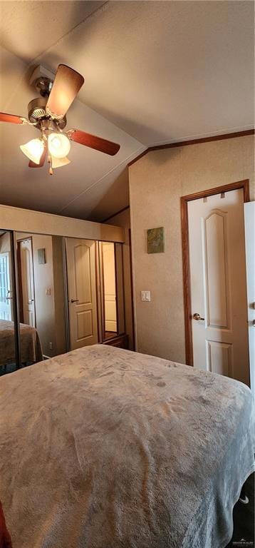 bedroom featuring ceiling fan and vaulted ceiling