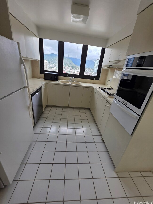 Kitchen with recently upgraded appliance suite