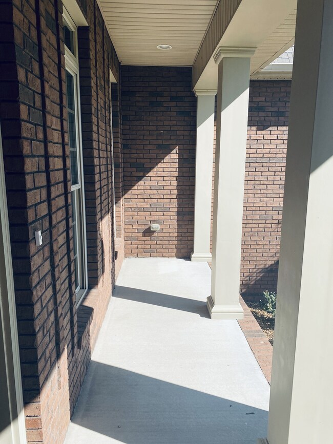 Covered front porch that overlooks a beautiful pond!!
