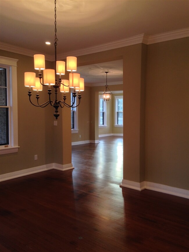 Dinning Room view into the Foyer and Living Room.  All new light fixtures, ceiling fans and recessed lighting throughout.