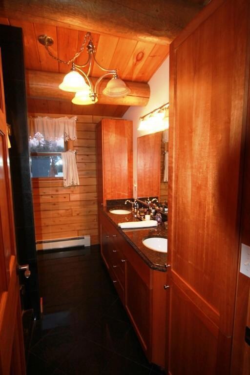 Master bath with cherry cabinets,...