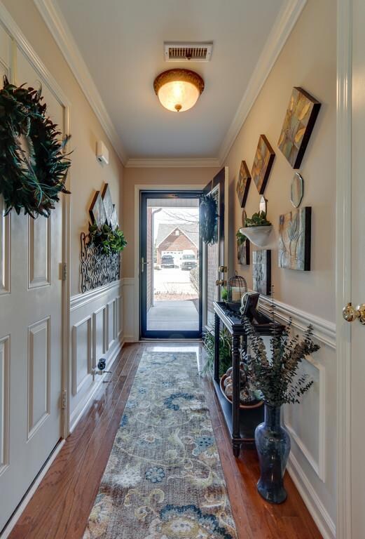 Great entry way with gleaming hardwood flooring and exquisite trim work welcomes you!