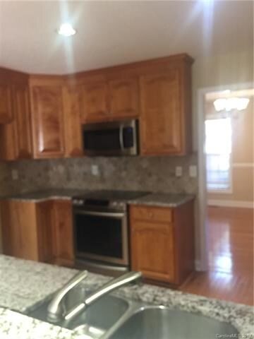 Kitchen with granite countertops and SS appliances