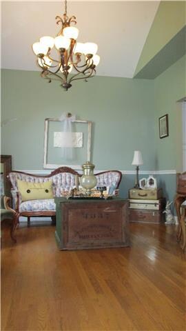 Formal dining room currently being used as a staging room for sellers wedding business. 