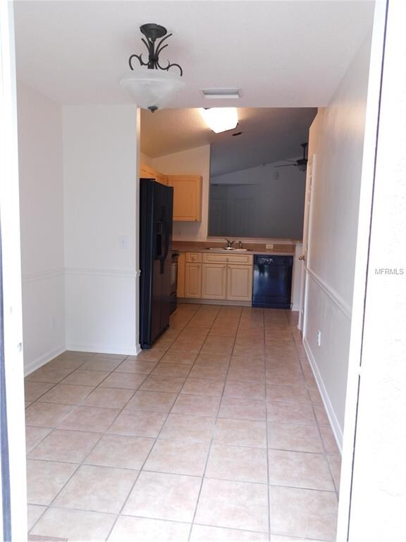 View of kitchen and eat in from the slider